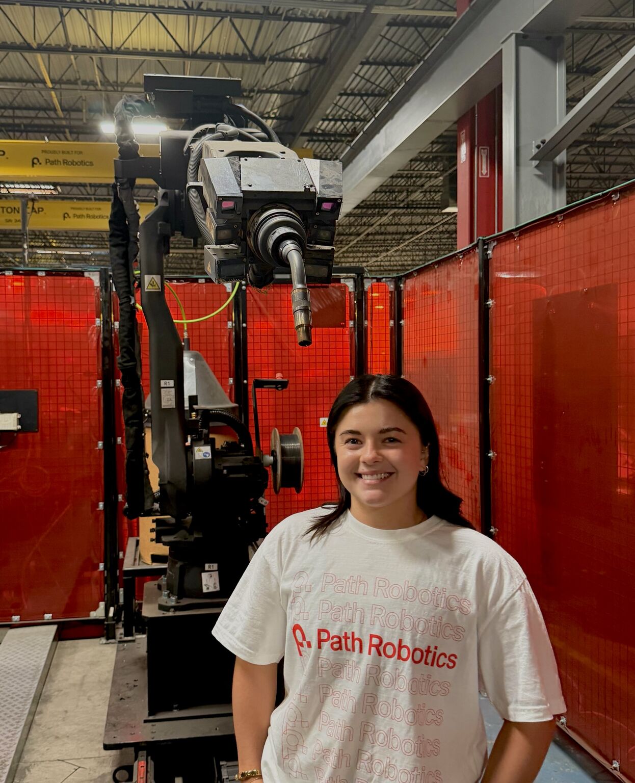 On the floor with a Yaskawa welding robot at Path Robotics